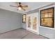 Covered patio with French doors and ceiling fan at 4010 Avalon Ave, Charlotte, NC 28208