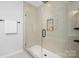 Spa-like shower with beige tile and glass enclosure at 4010 Avalon Ave, Charlotte, NC 28208