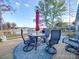 Deck overlooking the lake with seating for relaxing and entertaining at 4980 Kiser Island Rd, Terrell, NC 28682