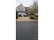 Two-story home with a three-car garage and driveway at 6334 Dillard Ridge Dr, Charlotte, NC 28216