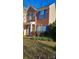 Two-story brick and beige townhome with blue shutters at 6334 Dillard Ridge Dr, Charlotte, NC 28216