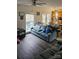 Spacious living room with teal couch and wood-look floors at 6334 Dillard Ridge Dr, Charlotte, NC 28216