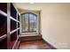 Home office or library with built-in bookshelves and window seat at 7292 Three Sisters Ln, Concord, NC 28027