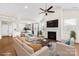 Virtually staged living room showcasing the layout with furniture, fireplace, and natural light at 8142 Kalson St, Huntersville, NC 28078