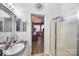 Bathroom with vanity, shower, and view into bedroom at 1115 Marys Grove Church Rd # 1, Kings Mountain, NC 28086