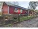 Red metal sided house with a fenced yard at 1115 Marys Grove Church Rd # 1, Kings Mountain, NC 28086