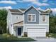 Two-story home with gray and beige siding, a two-car garage, and a dark blue front door at 114 Mountain Bridge Way, Statesville, NC 28625