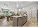 Modern kitchen features a large island, stainless steel appliances, and light gray cabinetry at 1184 Lost Cove Rd, Indian Land, SC 29707