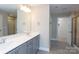 Double vanity bathroom with grey cabinets at 169 Wylie Trl, Statesville, NC 28677