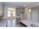 Kitchen boasts granite countertops and gray cabinets, offering a stylish space at 169 Wylie Trl, Statesville, NC 28677