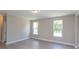 Living room features neutral walls, hardwood floors and multiple windows at 169 Wylie Trl, Statesville, NC 28677