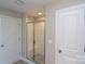 Clean shower with glass enclosure and tiled walls at 169 Wylie Trl, Statesville, NC 28677