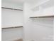 Spacious walk-in closet with shelving and rods at 169 Wylie Trl, Statesville, NC 28677