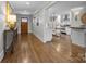 Bright entryway with hardwood floors and a view into the kitchen at 1818 Wandering Way Dr, Charlotte, NC 28226