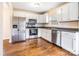 Kitchen with stainless steel appliances and hardwood floors at 202 Belton Ave, Mount Holly, NC 28120