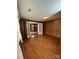 Wood-paneled room with hardwood floors and french doors leading to another room at 2330 Lower Palmer Rd, Salisbury, NC 28146