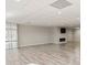 Large open basement with laminate flooring, fireplace, and wall-mounted TV at 2505 Ashford Dr, Newton, NC 28658