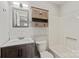 Updated bathroom with subway tile, vanity, and combination tub/shower at 2505 Ashford Dr, Newton, NC 28658