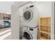 Laundry room with stacked washer and dryer and built-in shelving at 2505 Ashford Dr, Newton, NC 28658