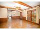 Dining area with wood paneling, access to backyard and hardwood floors at 327 Wednesbury Blvd, Charlotte, NC 28262