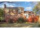 Back exterior view of two-story brick home with deck and patio at 327 Wednesbury Blvd, Charlotte, NC 28262