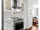 Sleek kitchen featuring stainless steel appliances and white cabinetry at 3919 Sunnycrest Ln, Charlotte, NC 28217