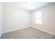 Bright bedroom with neutral walls and carpeted floor at 630 Smith St # B, Mooresville, NC 28115
