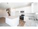 Modern kitchen with white cabinets and granite countertops at 630 Smith St # B, Mooresville, NC 28115