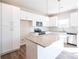 Modern kitchen featuring white cabinets, granite countertops, and stainless steel appliances at 630 Smith St # B, Mooresville, NC 28115