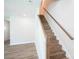 Elegant staircase with wood treads and white railings leading to the upper level at 630 Smith St # B, Mooresville, NC 28115