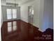 Formal dining room with hardwood floors and wainscoting at 6503 Bells Mill Dr, Charlotte, NC 28269