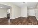 Open living area with hardwood floors and views to entryway and kitchen at 8604 Warwick Crest Ln, Charlotte, NC 28215