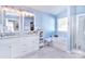 Elegant bathroom with double vanity and soaking tub at 8717 Sedgeburn Dr, Charlotte, NC 28278