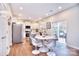 Modern kitchen with island and white cabinets at 8717 Sedgeburn Dr, Charlotte, NC 28278