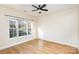 Bright bedroom featuring a large window and ceiling fan at 9315 Meadow Vista Rd, Charlotte, NC 28213