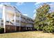 Brick building with multiple levels, balconies, and landscaping at 9315 Meadow Vista Rd, Charlotte, NC 28213