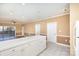 White kitchen with breakfast bar and access to patio at 9315 Meadow Vista Rd, Charlotte, NC 28213