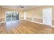 Living room with hardwood floors and sliding doors to patio at 9315 Meadow Vista Rd, Charlotte, NC 28213