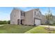 Two-story house with stone accents and a two-car garage at 1015 20Th Avenue Se Loop, Hickory, NC 28602