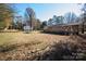 Large backyard with a wooden fence and mature trees at 1022 Harper Keefe Rd, Indian Land, SC 29707