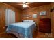 Simple bedroom with a double bed and wood-paneled walls at 108 Fathom Trl # 178, Mount Gilead, NC 27306