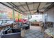 Relaxing covered porch with seating area and views of the yard at 108 Fathom Trl # 178, Mount Gilead, NC 27306