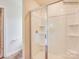 Clean shower with glass enclosure and built-in shelving at 15147 Windy Plains Rd, Charlotte, NC 28262