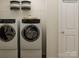 Laundry room with washer, dryer, and overhead storage at 15229 Windy Plains Rd, Charlotte, NC 28262