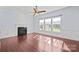 Living room featuring hardwood floors, fireplace, and large windows at 2299 Elendil Ln, Charlotte, NC 28269