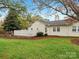 House's backyard, featuring a white fence and lawn at 2713 New Hamlin Way, Charlotte, NC 28210