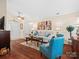 Bright living room with hardwood floors, comfy seating, and a view of the front entrance at 2713 New Hamlin Way, Charlotte, NC 28210