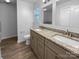 Double vanity bathroom with granite countertops and tile flooring at 4438 Cochran Farm Ln, Charlotte, NC 28269
