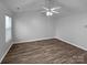 Spacious bedroom with hardwood floors and a ceiling fan at 4438 Cochran Farm Ln, Charlotte, NC 28269