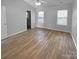 Bright bedroom with hardwood floors and window coverings at 4438 Cochran Farm Ln, Charlotte, NC 28269